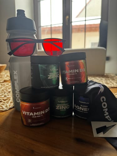 Customer's two jars of Immunity Zinc shown with other Complex brand supplements on a table.