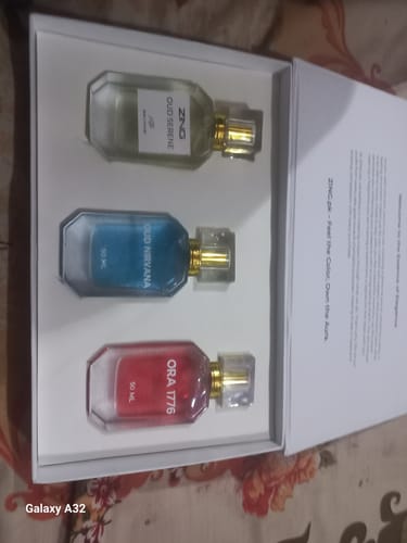Reviewer's OUD Supreme BUNDLE with the three colorful fragrances, Nirvana, Serene, and Ora 1776, in a white box.