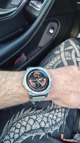 Customer wearing the Gard Pro Ultra 3 watch on their wrist, showing its silver case and detailed digital face.