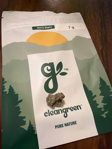 Customer's two White Runtz buds in front of the product's 7g pouch.