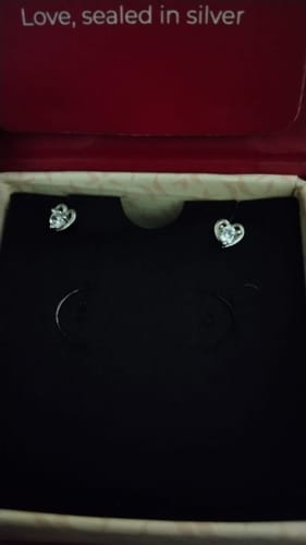 Customer's Silver Heart Studs displayed in their red and black jewelry box.