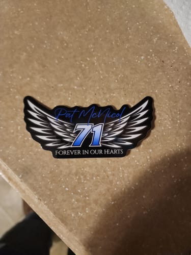 Customer's custom memorial vinyl sticker with a wing design, reading 'Pat McNicol 71 Forever In Our Hearts'.