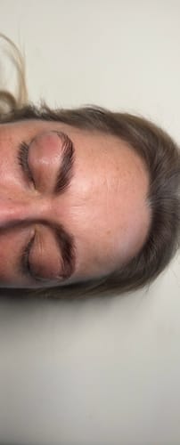 Close-up of a reviewer's neat, laminated brows after using the Cysteamine Brow & Lash Lamination Kit.