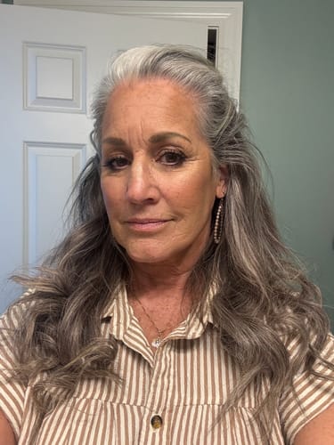 Reviewer showing her glowing, plump skin after using F-Balm tallow balm.