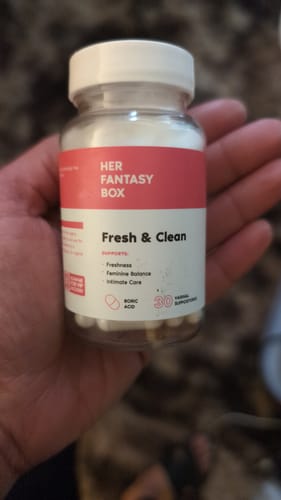 Reviewer holding a bottle of Her Fantasy Box Fresh & Clean boric acid suppositories in their hand.