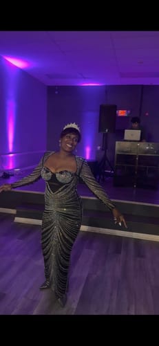 Customer wearing the sparkly Molly Black Rhinestone Maxi Dress with padded shoulders.
