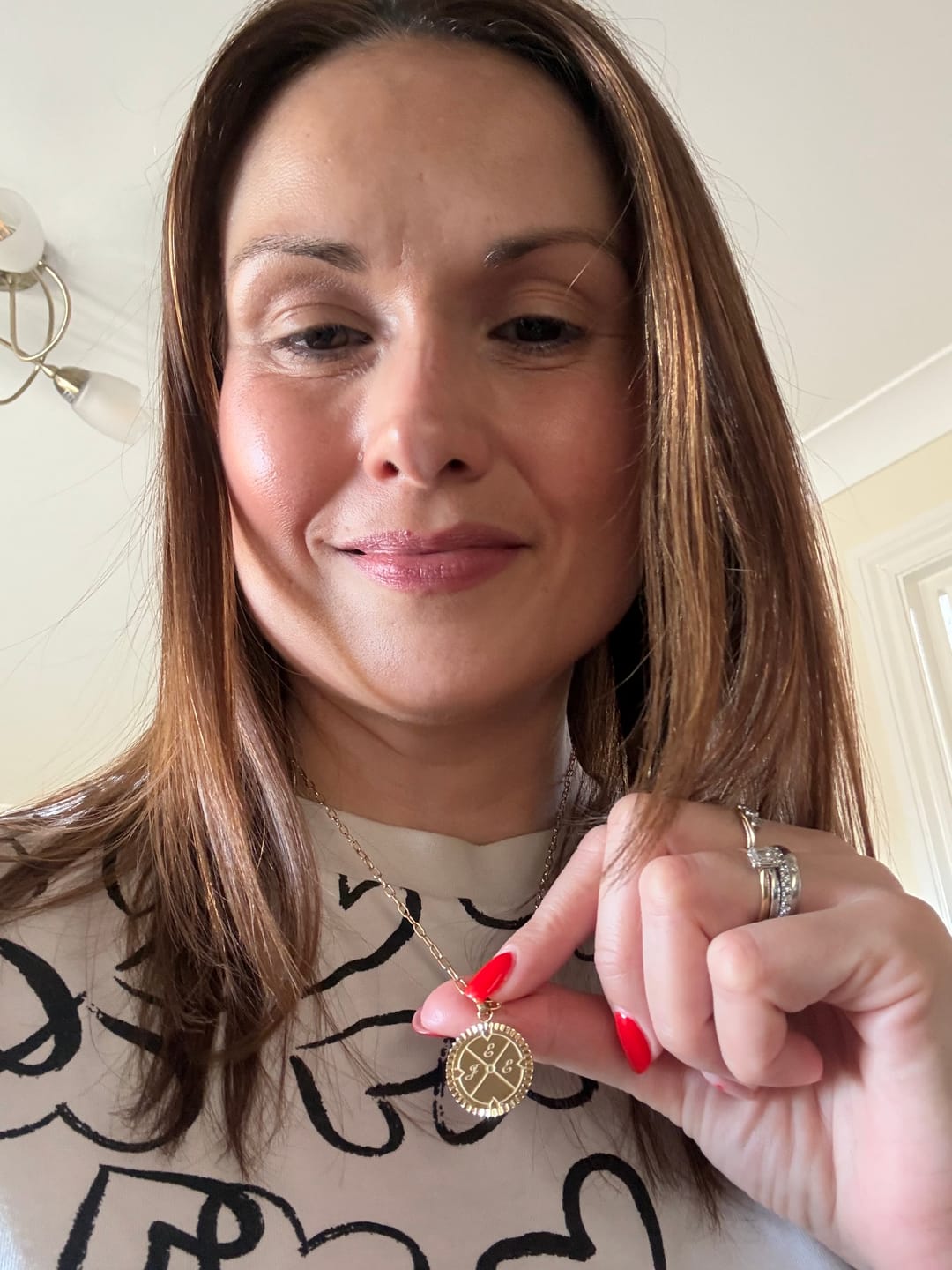 Customer photo review of Engravable Compass Necklace