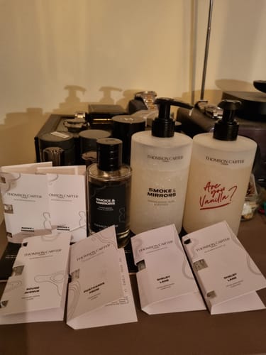 Reviewer's Fragrance Discovery Kit samples displayed with other Thomson Carter products on a tabletop.