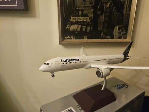 Customer's GEMINI200 Lufthansa 787-9 model airplane displayed on its stand, resting on top of the product box.