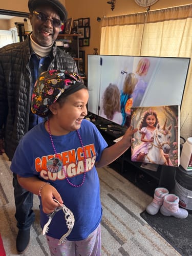 A happy customer holds her custom 'The Lavender Unicorn Princess' canvas, smiling brightly in her living room.