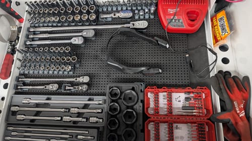 Reviewer's tool drawer organized with the Toolgrid system, with Corner Holders securing cases and other tools.
