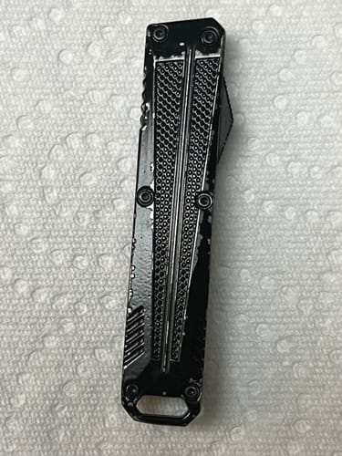 Customer's black VT Mini Stinger OTF Knife with chipped and flaking paint on its handle.