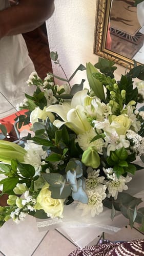 Reviewer's Classic White Bouquet, a lush arrangement of white lilies, roses, and other flowers.