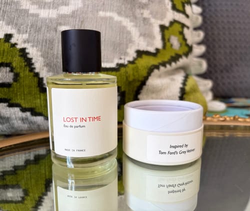 Customer's Lost in Time perfume bottle and round packaging displayed on a mirrored surface.