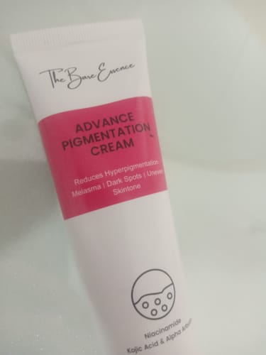 Reviewer's close-up of the white and pink tube of Advance Pigmentation Cream.