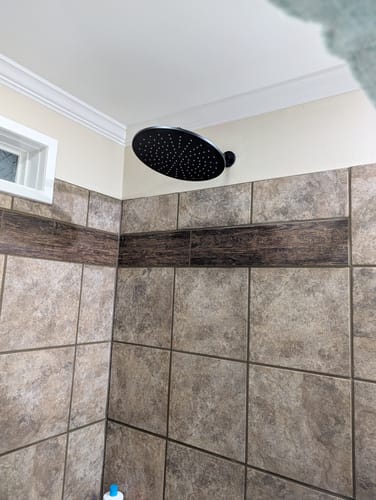 Customer's black 12 Inch Rain Shower Head installed in a tiled shower.