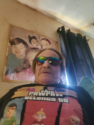 Reviewer wearing the colorful Gladius - Sports Blade sunglasses.