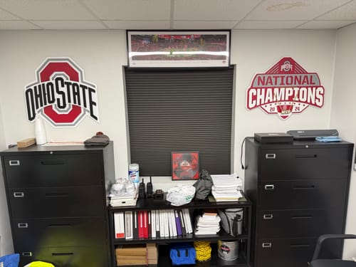 Reviewer's office decorated with three Ohio State 3D Metal Artworks on the walls above cabinets.