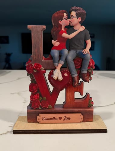 Customer's personalized Eternal LOVE wooden plaque showing a couple kissing above 'LOVE' lettering and red roses.