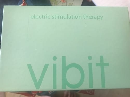 Reviewer shows the light green box for their Vibit TENS device.