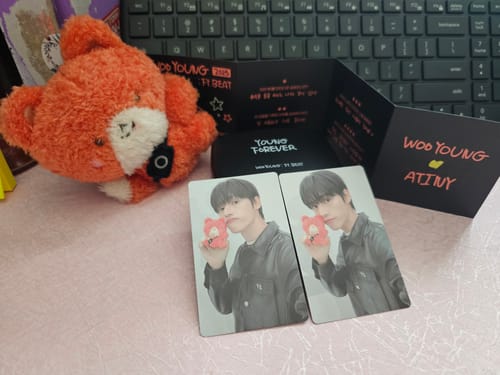 Reviewer's ATEEZ - WOOYOUNG : FY. BEAT album, showing the opened black packaging and two identical photocards.