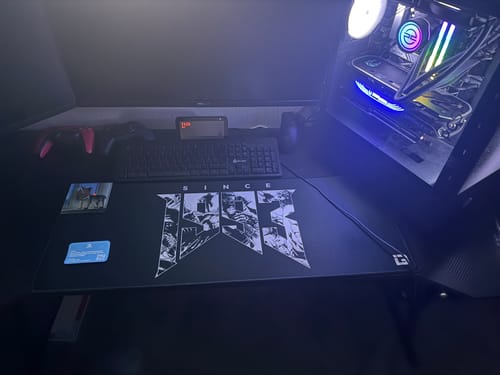 Customer's large 1993 Rip and Tear mousepad on a desk with a keyboard and glowing computer.