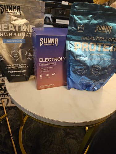 Customer's Ramadan Bundle supplements, including Creatine, Electrolytes, and Halal Collagen Protein, displayed on a small white table.