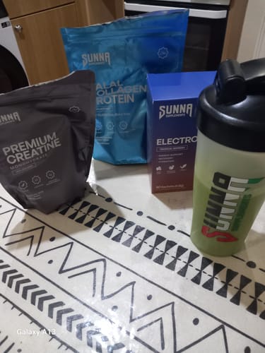 Reviewer's Ramadan Bundle supplements and shaker bottle from Sunna displayed on a patterned surface.