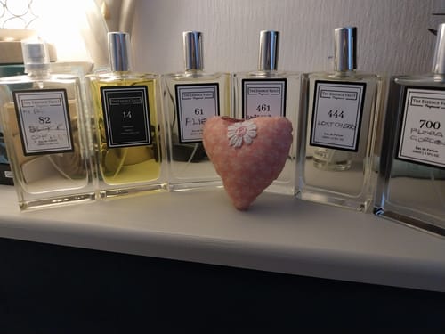 Customer's Inspired by Baracatt Rouge 540 perfume bottle shown on a shelf with five other fragrances from their collection.