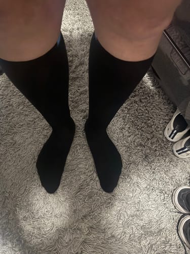 Customer's view of their legs and feet wearing the black Performance Eucalyptus Compression Socks.