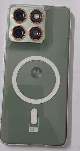 Customer's clear Magsafe case on a green Motorola phone, showing the fit around the camera and visible MagSafe ring.