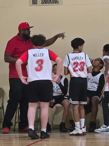 Customer's youth team in their white Custom Basketball Jersey Sets, showing personalized names and red numbers on the back.