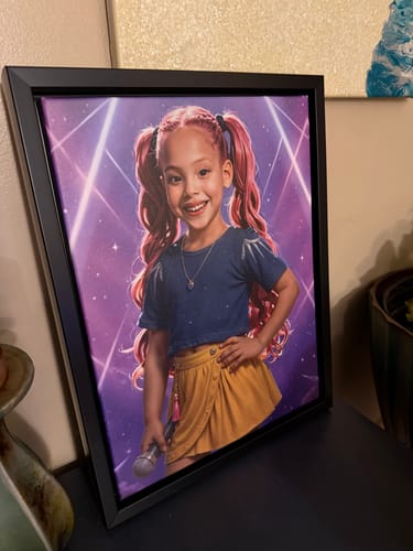 Customer's framed K-Pop Queen The Pink Comet portrait showing a happy girl with pink hair holding a microphone on a stage.