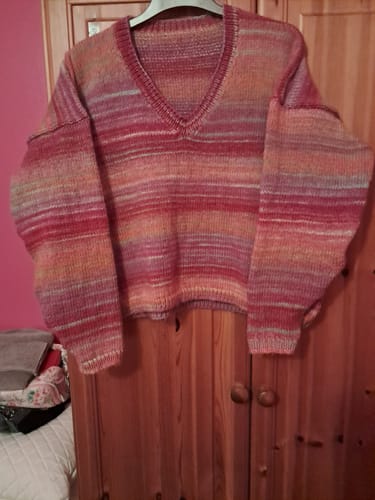 Customer's finished striped sweater, a v-neck project made with the Ladies Box kit.