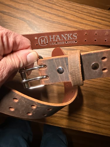 Reviewer compares a new brown Woodstock belt with an old one, showing the sturdy double-prong buckle.