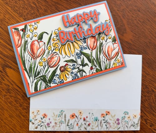 Customer uses the floral washi tape to decorate an envelope, matching a handmade card.