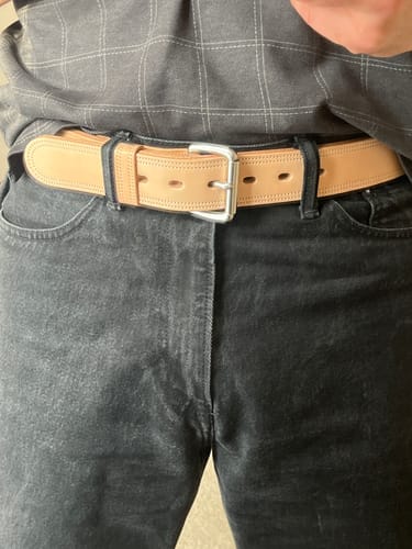 Customer wearing the thick, light brown Premier Double Layer belt with black jeans.