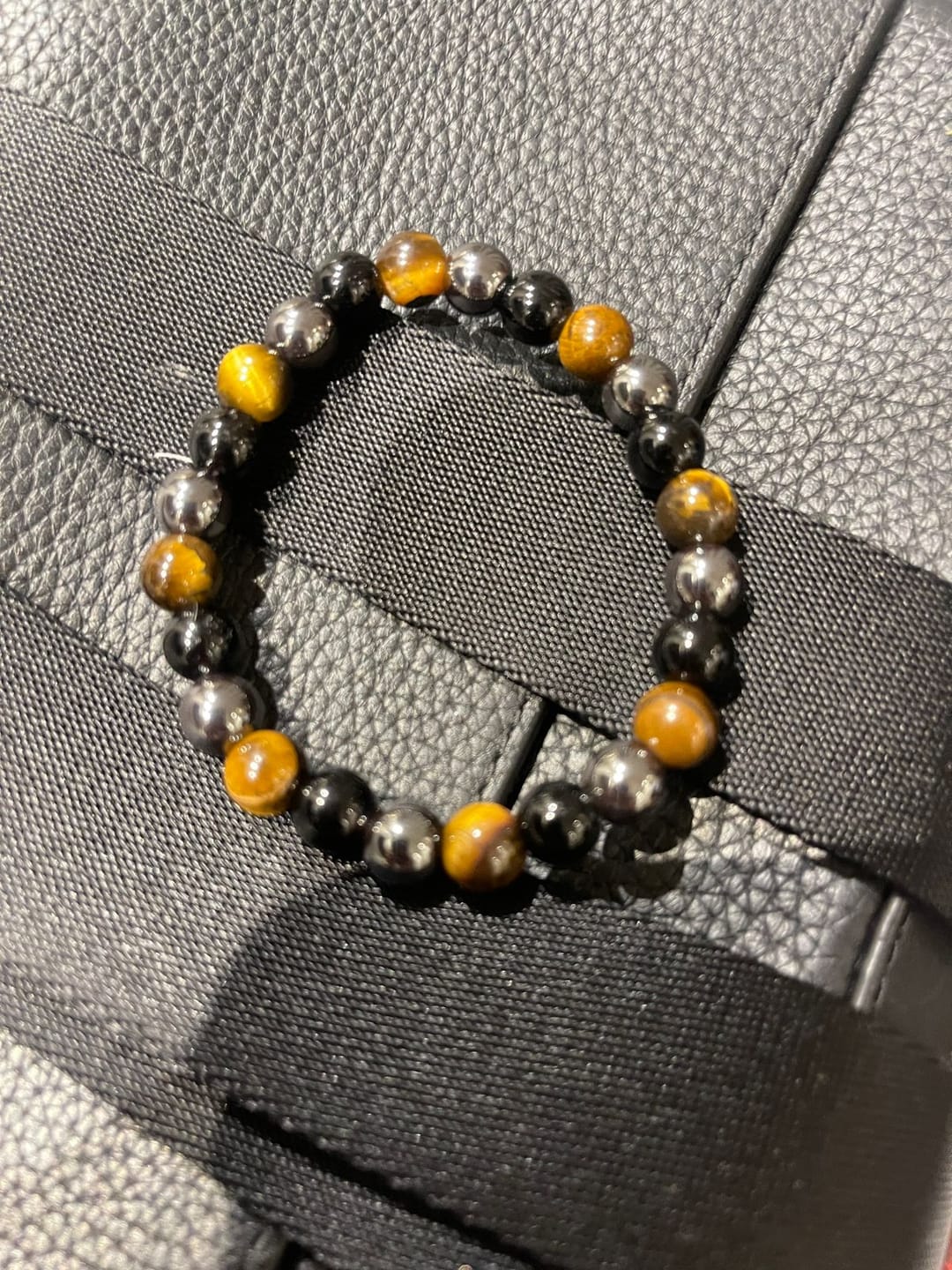 Customer photo review of 100% Natural Black Tourmaline, Hematite and Tiger Eye beads, Triple Protection Vastu Remedy Bracelet — 8mm Beads