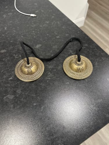 Customer photo review of Lotus Tingsha with Om Carving
