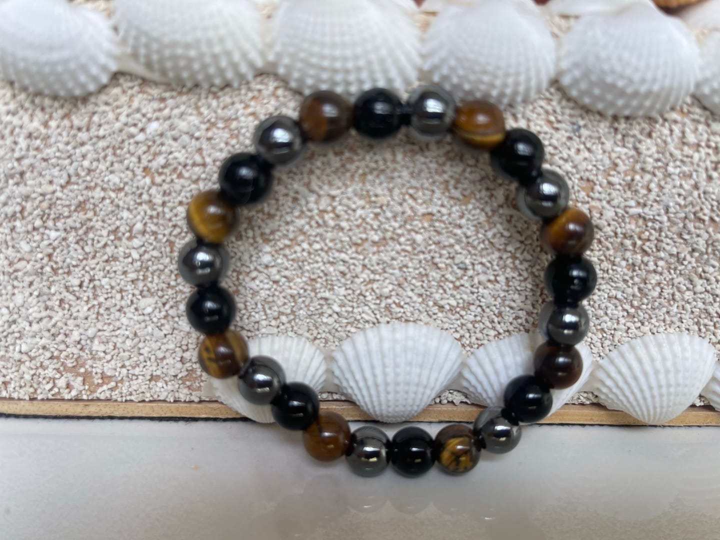 Customer photo review of 100% Natural Black Tourmaline, Hematite and Tiger Eye beads, Triple Protection Vastu Remedy Bracelet — 8mm Beads