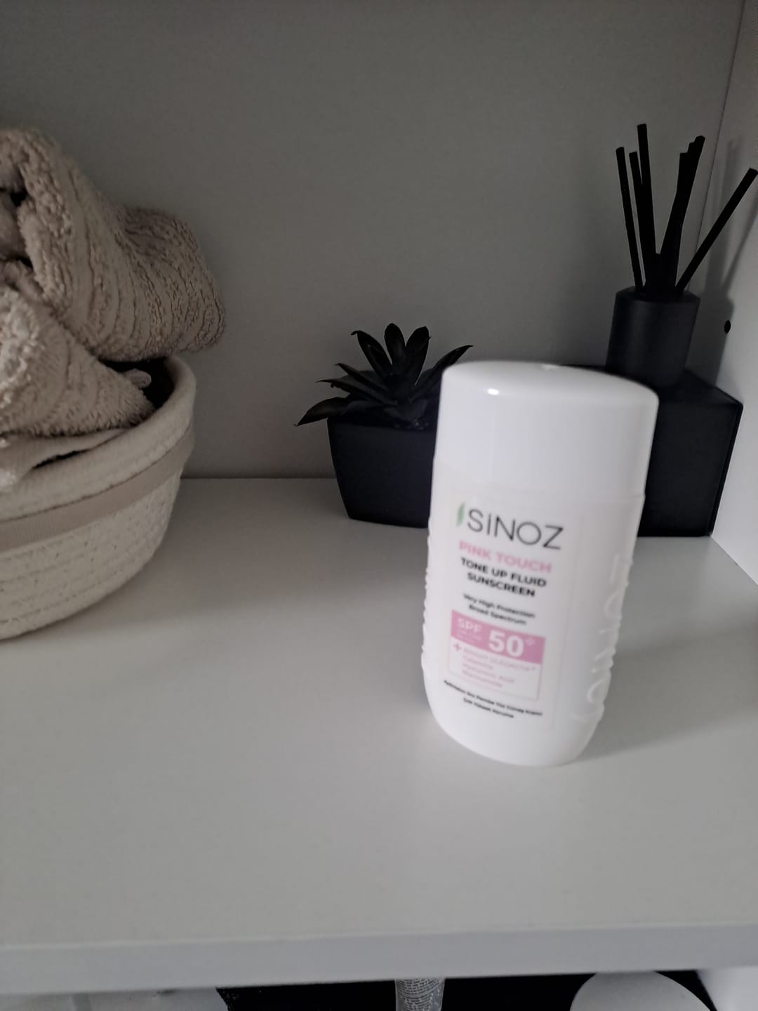 Customer photo review of Pink Touch Tone Up Fluid Sunscreen SPF 50 +