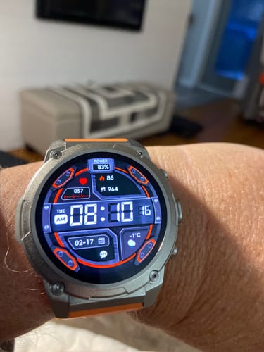 Reviewer's Gard Pro Ultra 3 smartwatch on their wrist, showing the detailed digital face with multiple widgets.