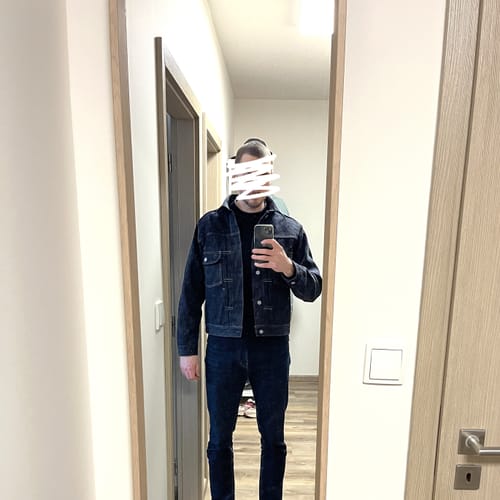 Reviewer in a mirror selfie wearing the washed Lot 52807XX Selvedge Denim Jacket.