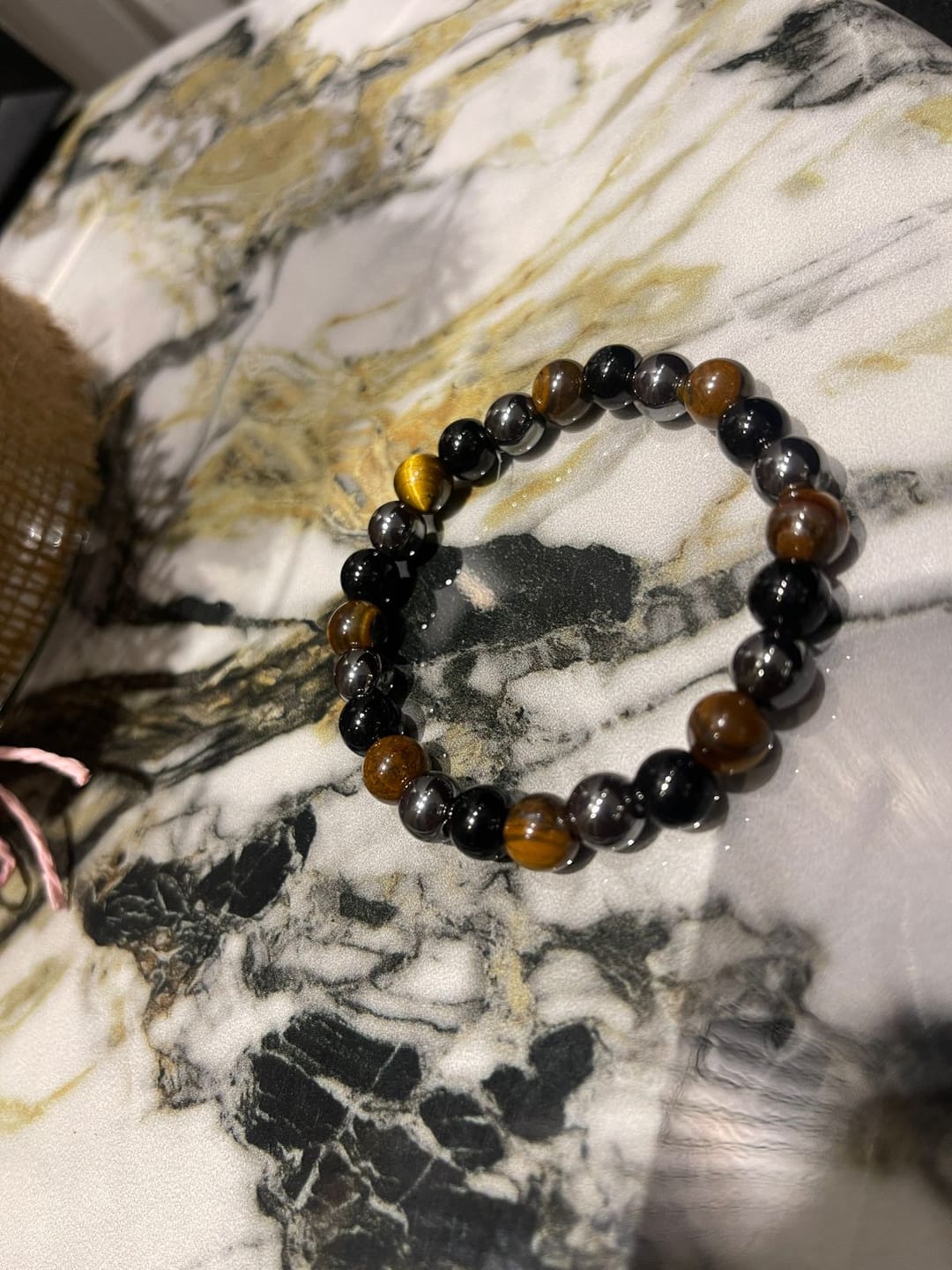 Customer photo review of 100% Natural Black Tourmaline, Hematite and Tiger Eye beads, Triple Protection Vastu Remedy Bracelet — 8mm Beads