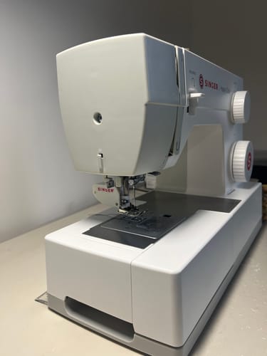 Customer's Singer Walking Foot attachment installed on a white sewing machine, ready to use.