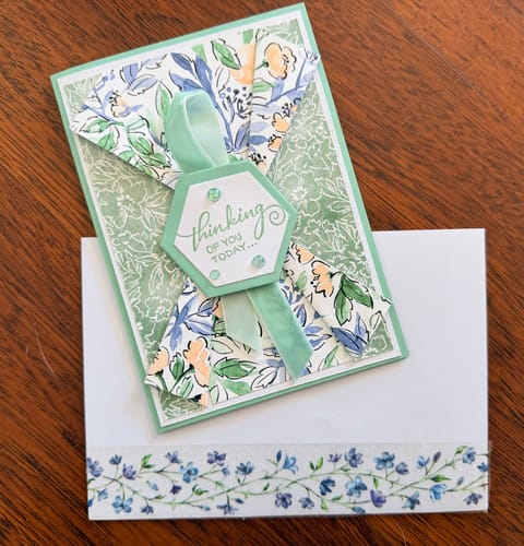 Customer's handmade card and envelope set, with the clear blue flower washi tape decorating the envelope.