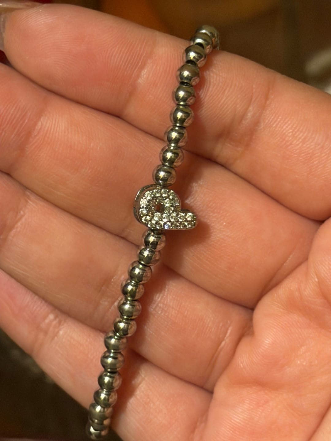 Customer photo review of Pulsera Plateada Con Inicial Mini Bubble Zirconia