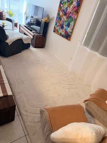 Customer's large, vanilla cream Mellow Mat adding a cozy feel to their living room.