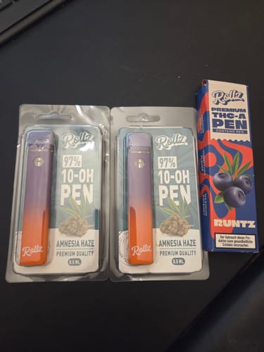 A customer's two sealed 10-OH Superior LIVE RESIN VAPEs in their Amnesia Haze packaging on a desk.