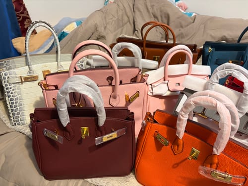 Customer's collection of colorful Warkin Bags, including pink, orange, and burgundy styles, displayed together.